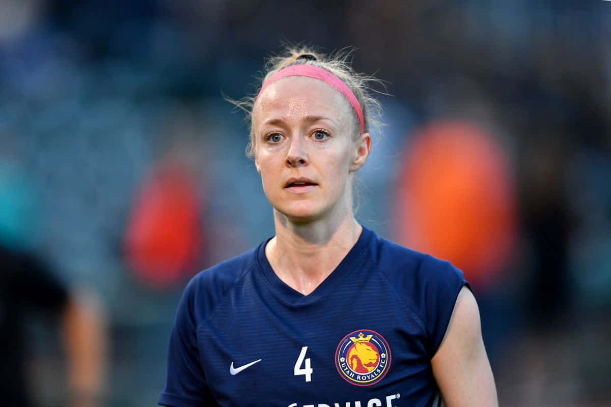 Becky Sauerbrunn In Action On The Football Field Background