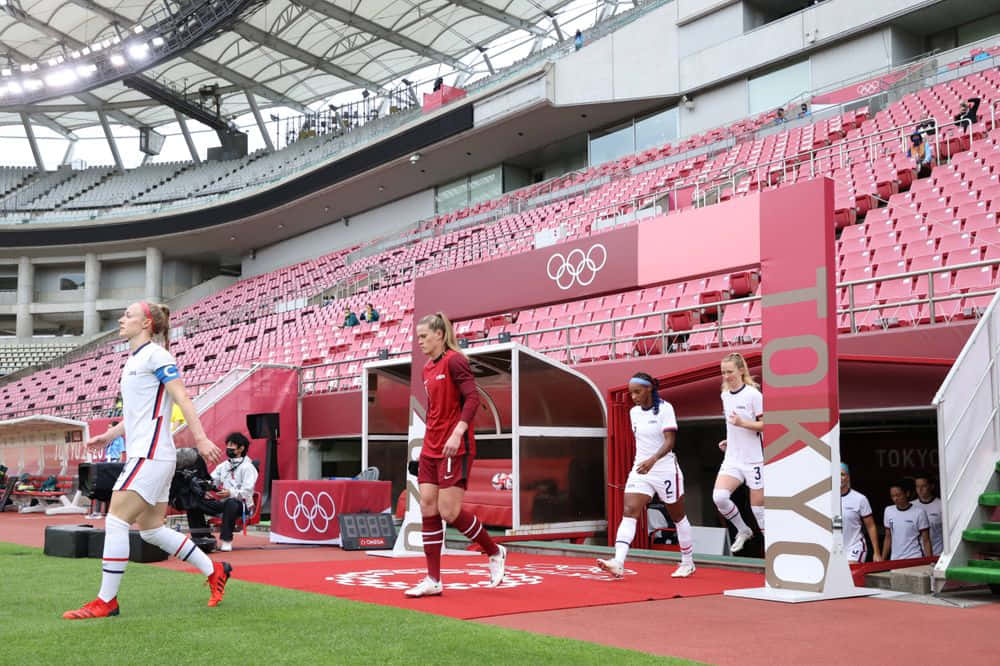 Becky Sauerbrunn In Action On The Soccer Field Background