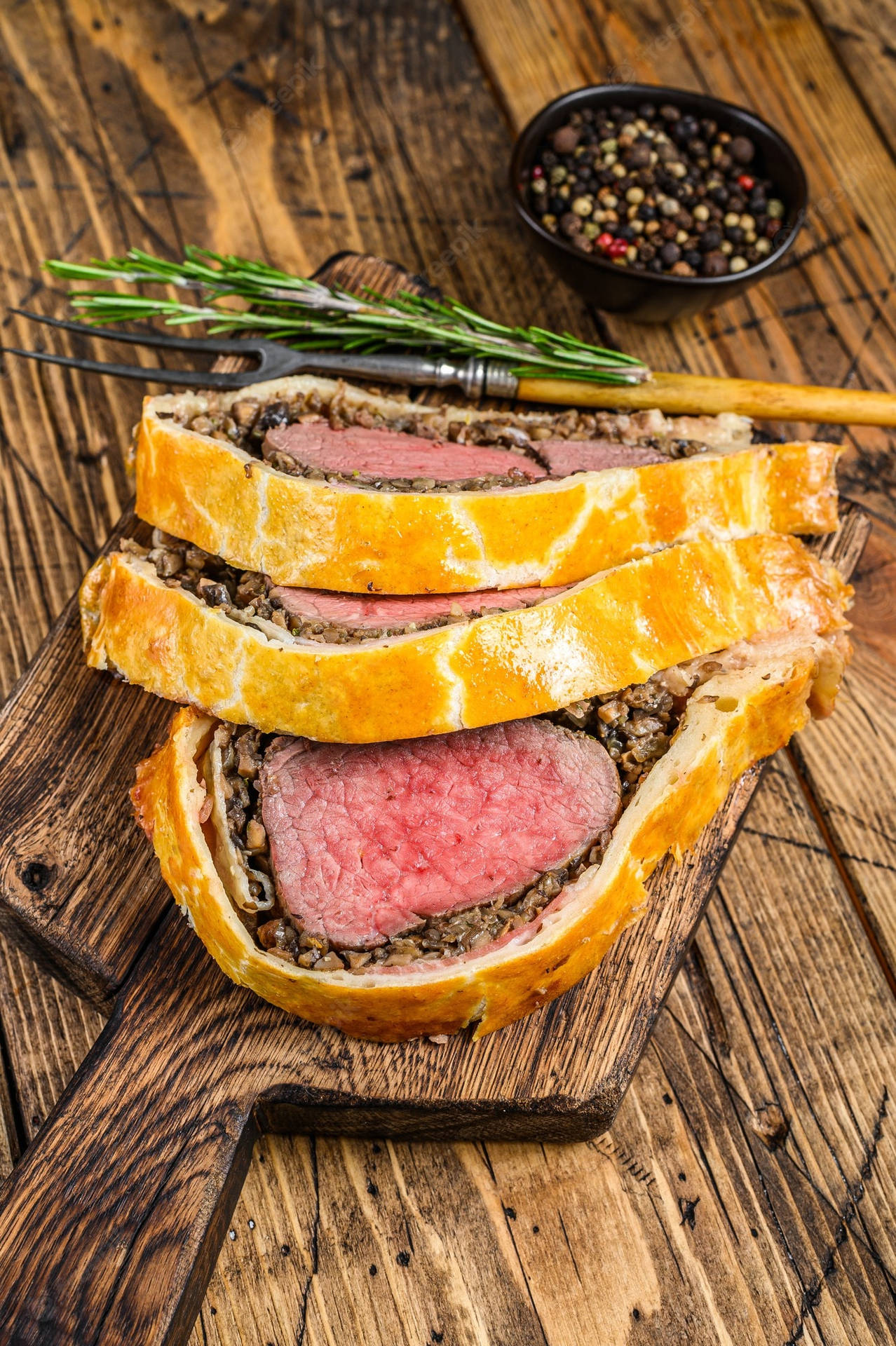 Beef Wellington Wooden Rosemary Background