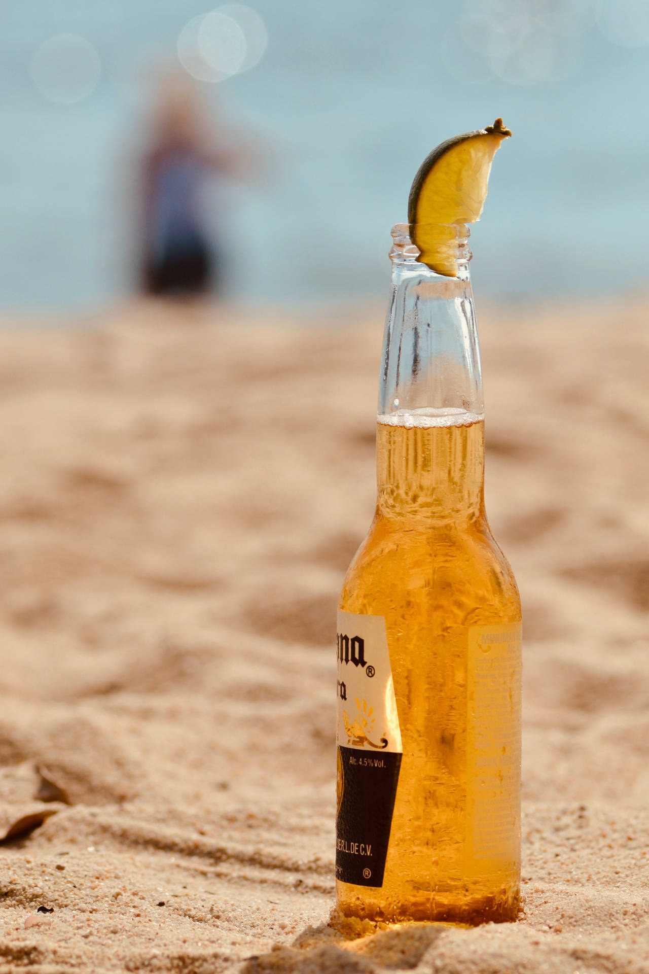 Beer Bottle Corona With Lime Wedge Background