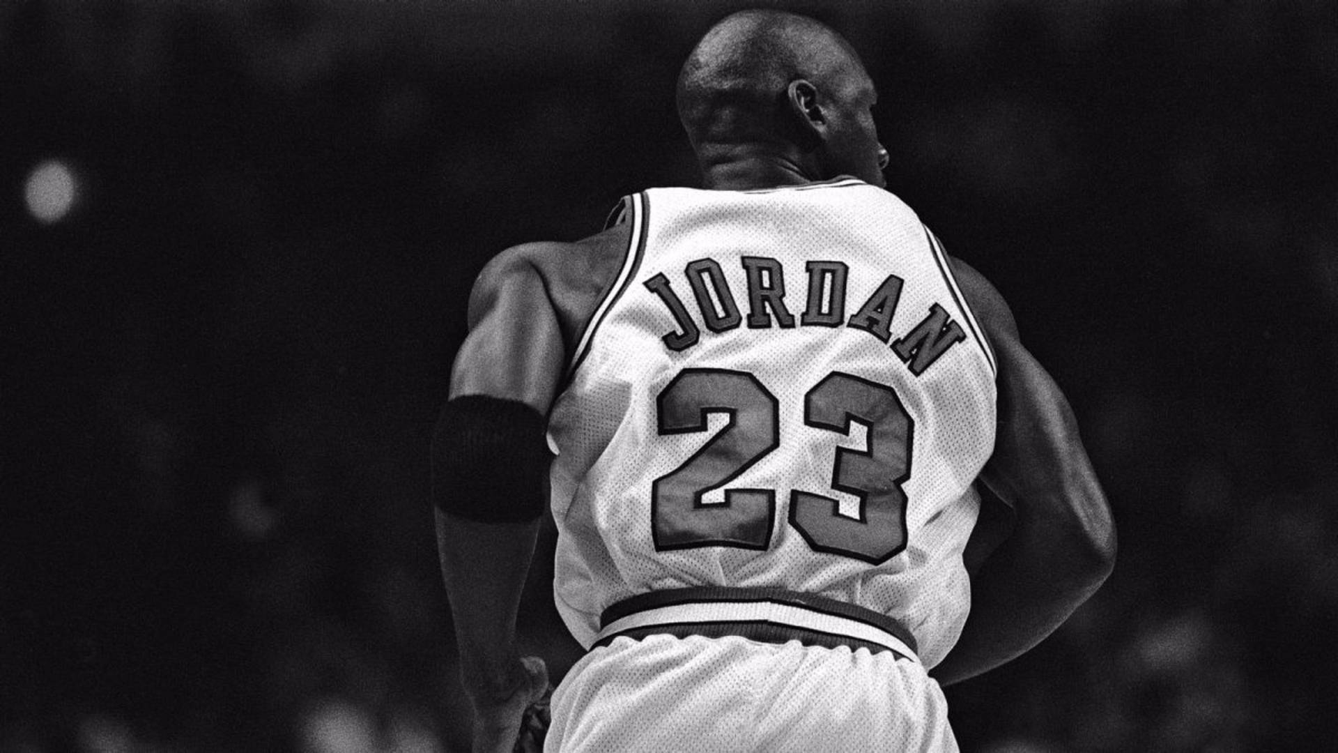 Behind Michael Jordan White Jersey Background
