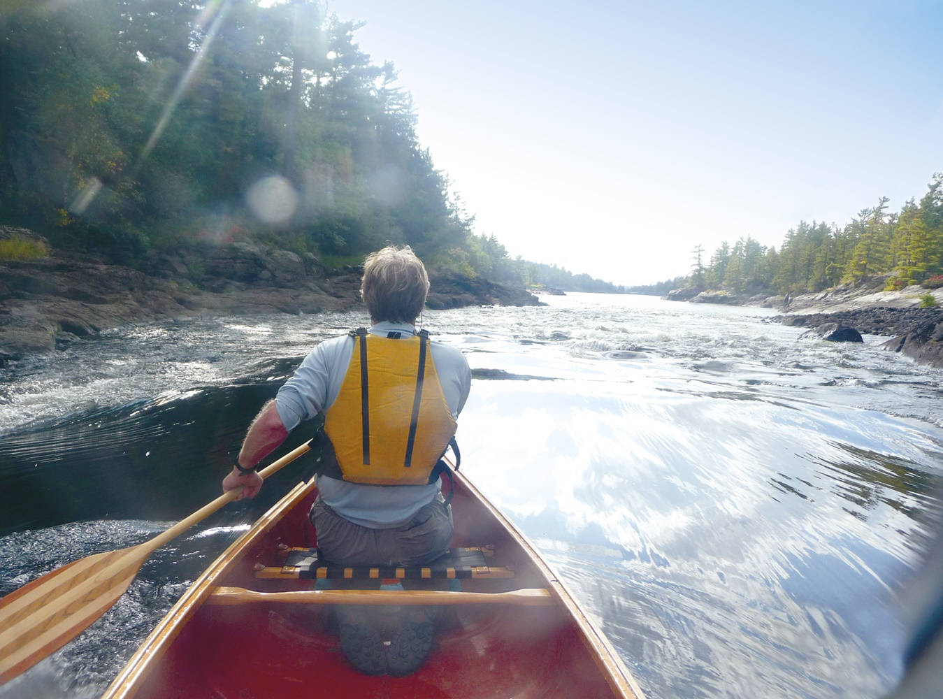 Behind The Canoeing Man Background