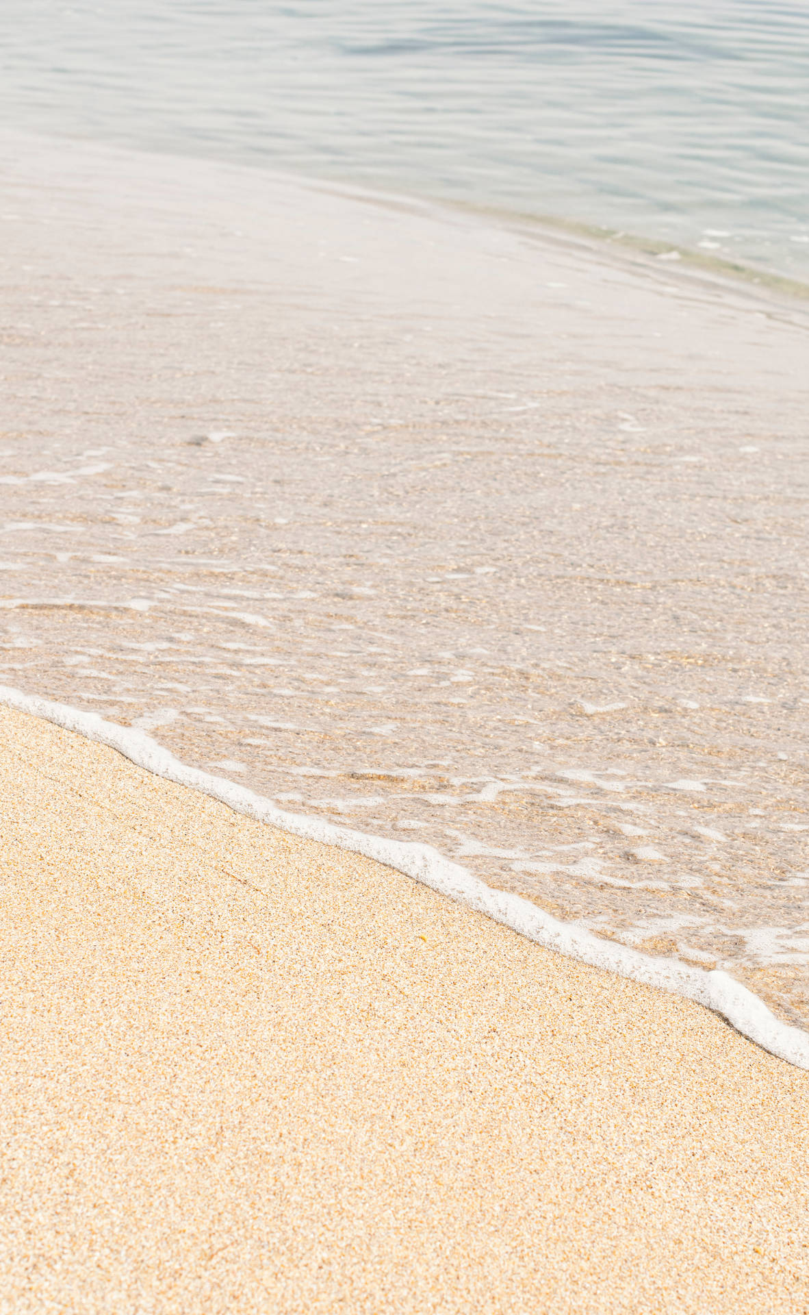 Beige Sand On Seashore