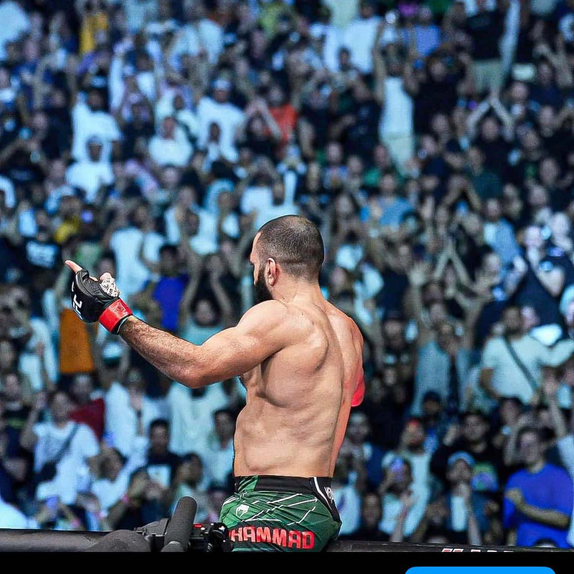 Belal Muhammad Posing For The Crowd Background