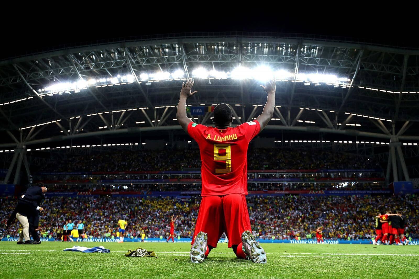 Belgium National Football Team Kneeling Victory Background