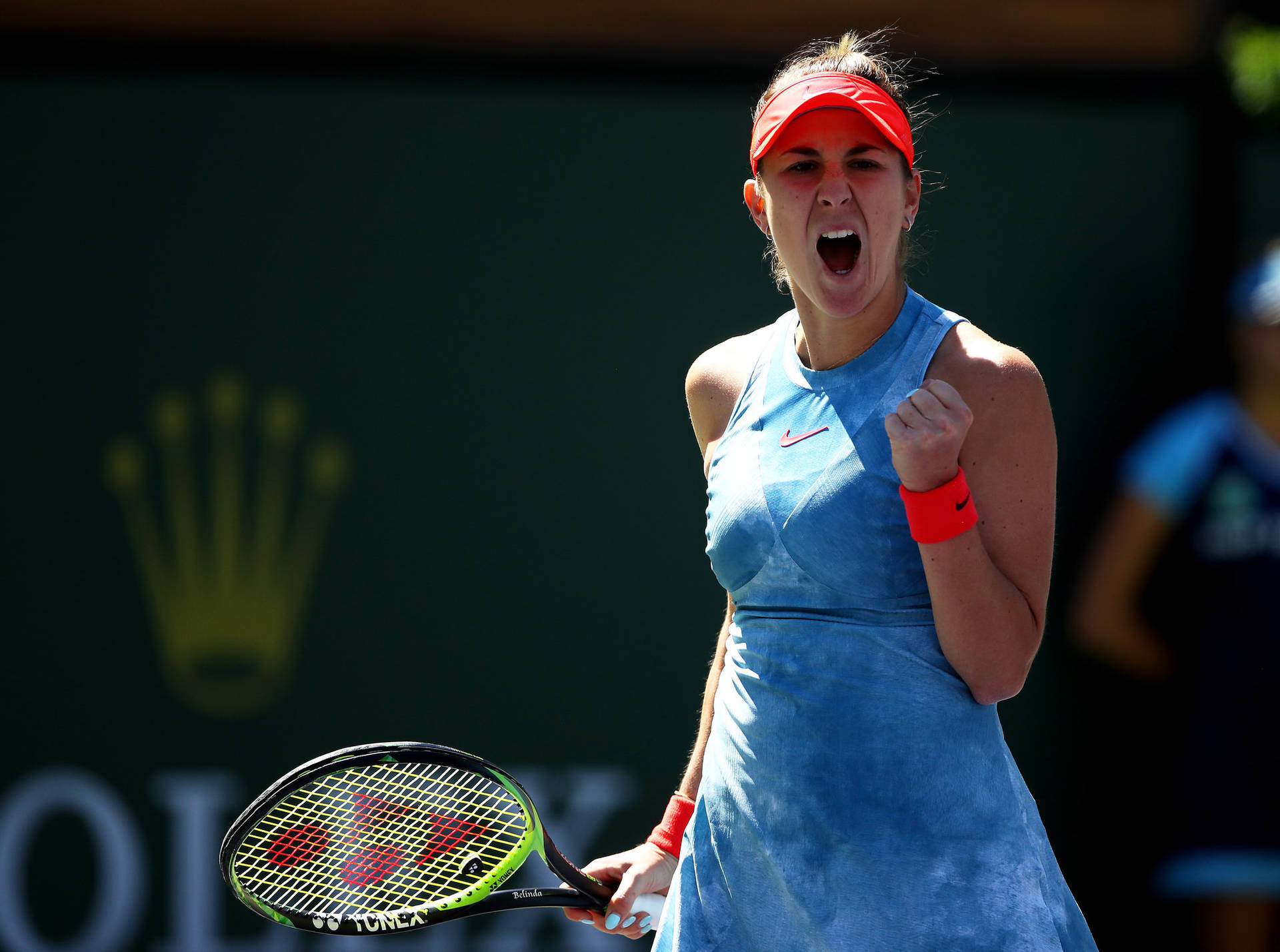 Belinda Bencic Celebrates A Win In Her Signature Blue Attire Background