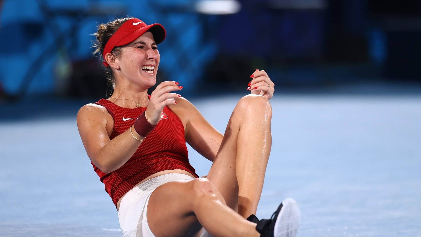 Belinda Bencic Sitting On Ground Background