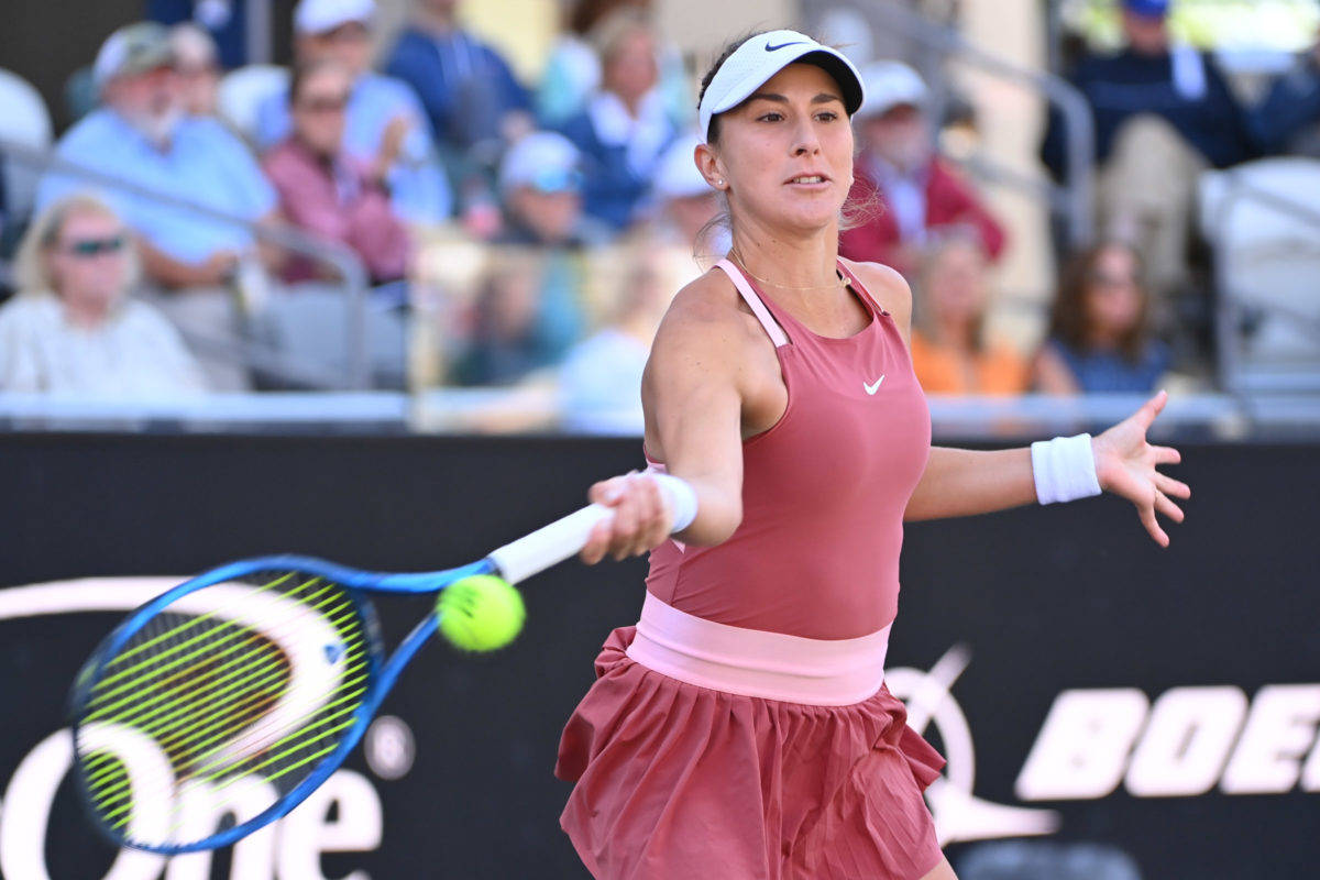 Belinda Bencic Wearing Dark Pink Outfit Background