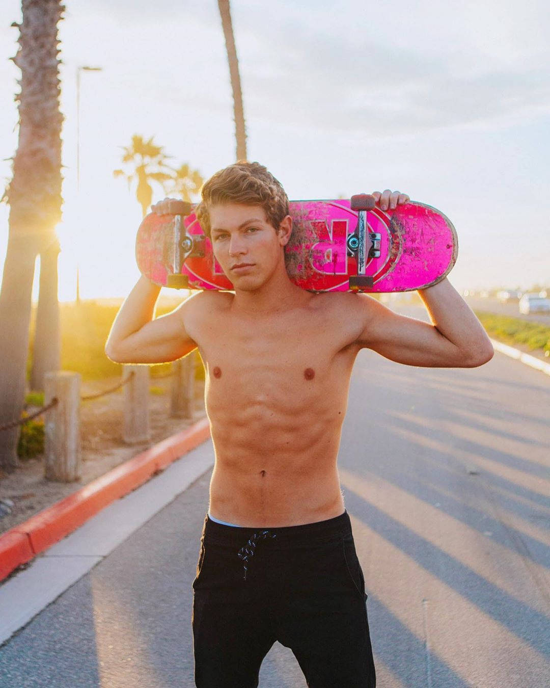 Ben Azelart Carrying A Skateboard Background
