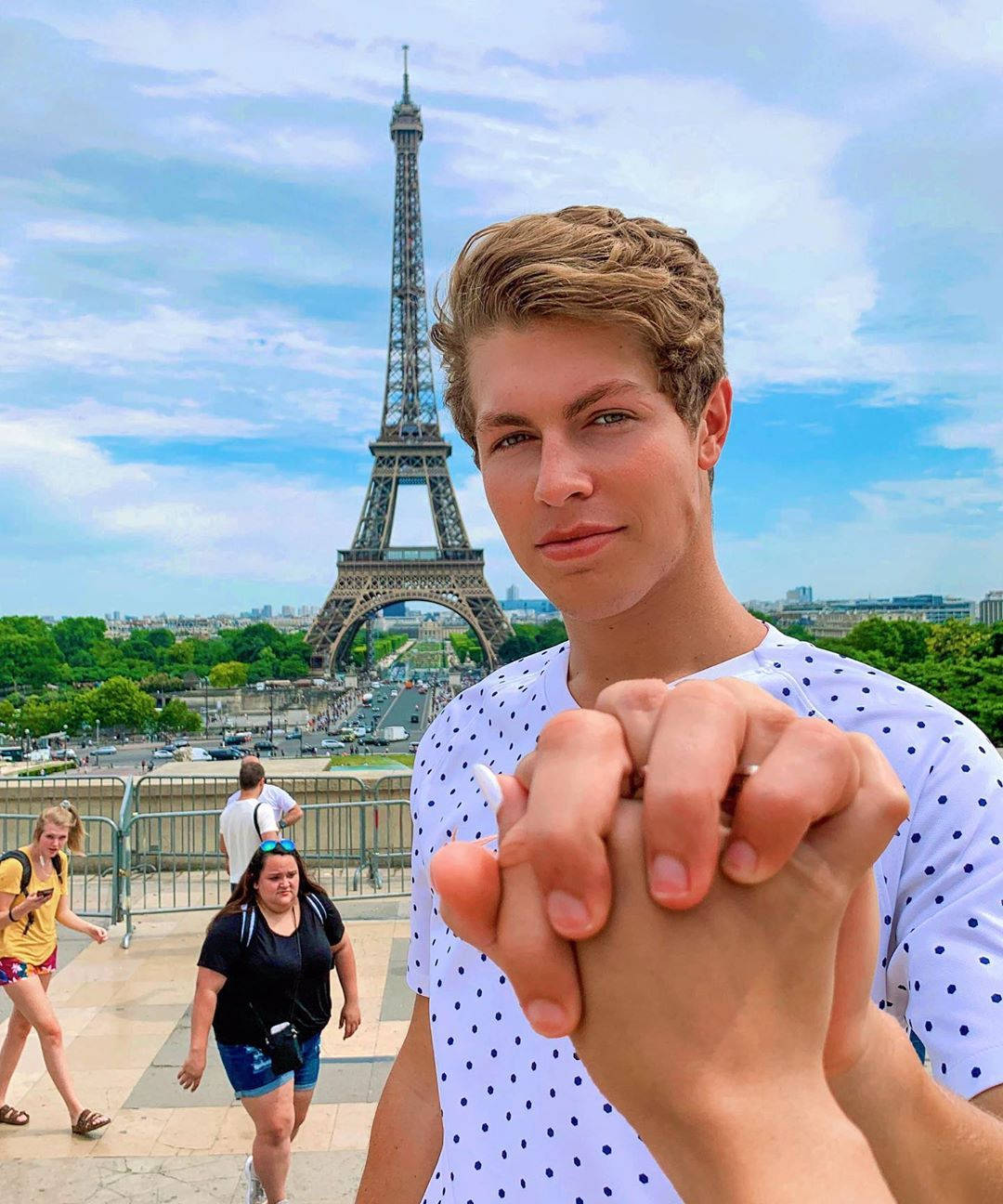 Ben Azelart Holding Hands In Paris Background