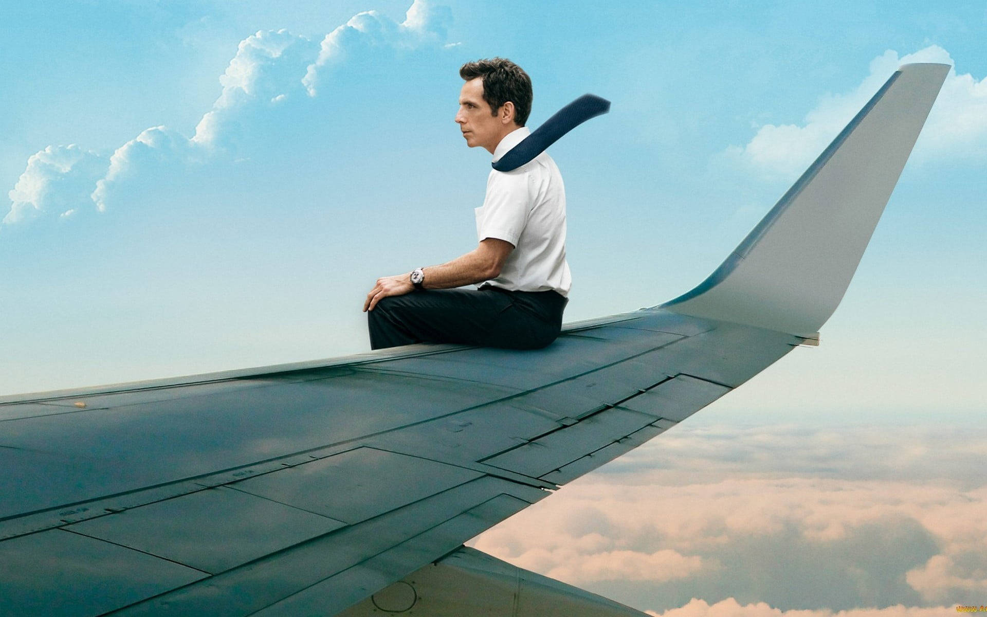 Ben Stiller Sitting On A Wing Plane Background