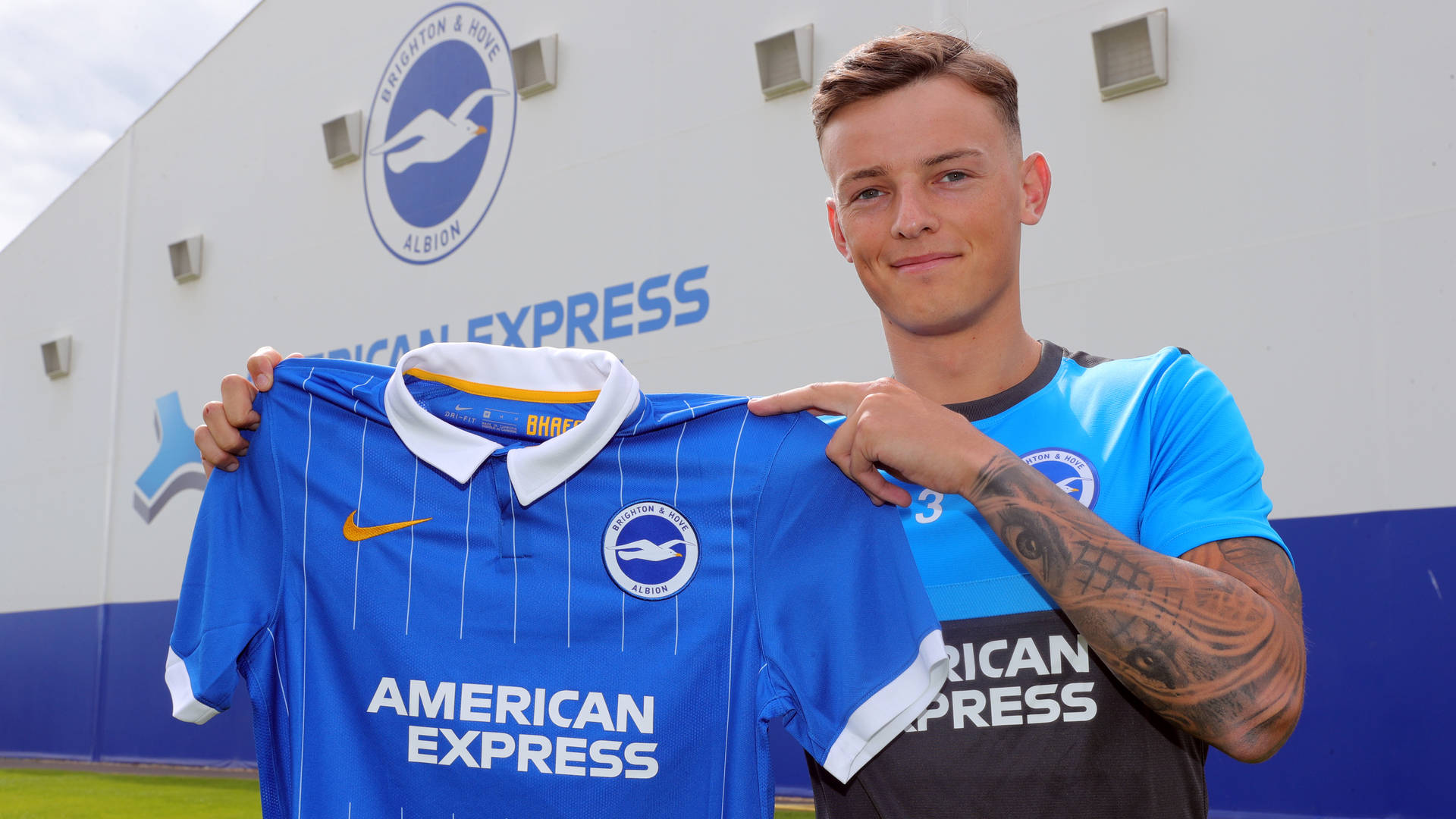 Ben White Holding Brighton Shirt Background