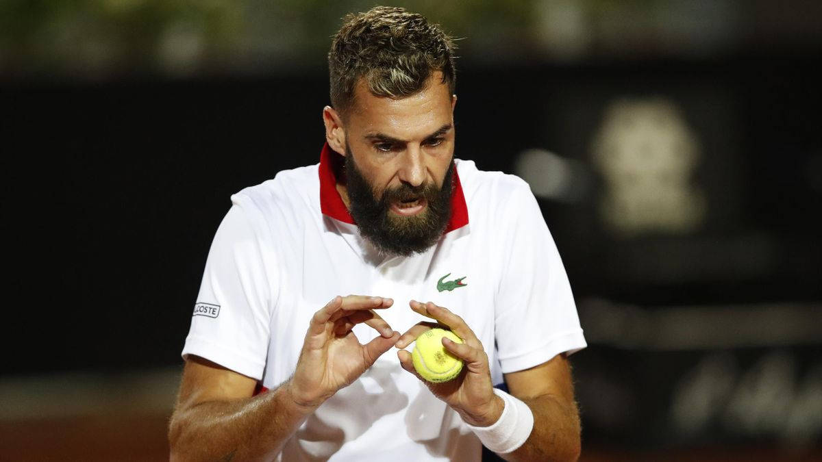 Benoit Paire Displaying Intense Focus During A Tennis Match. Background