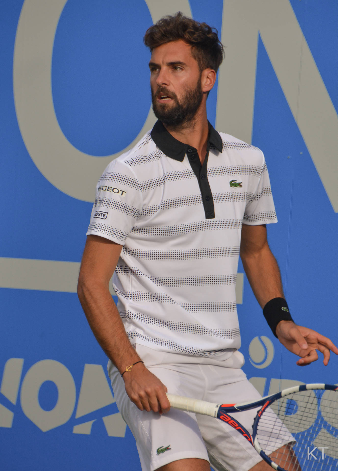 Benoit Paire In Action On The Tennis Court Background