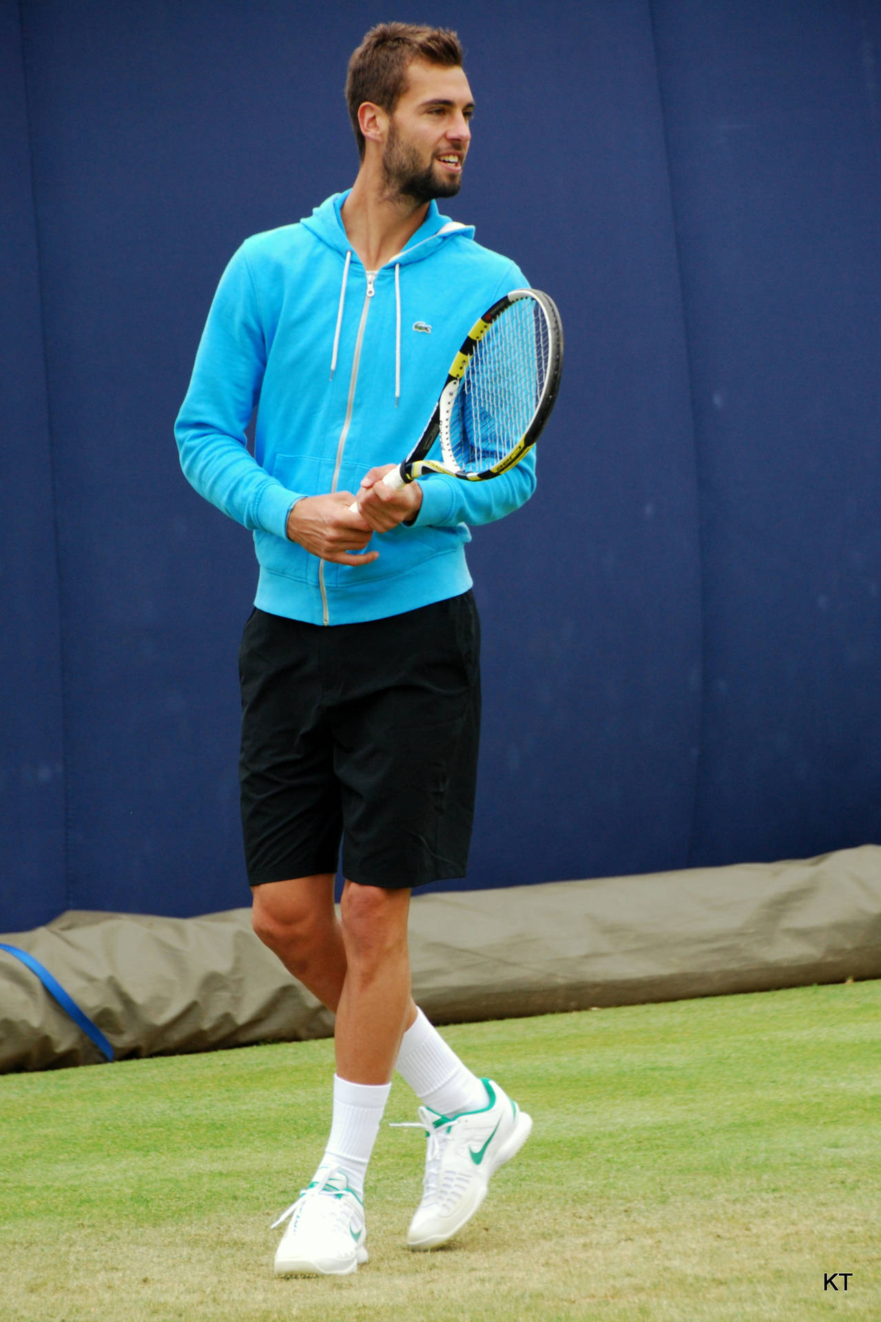 Benoit Paire Standing Cross Leg Background