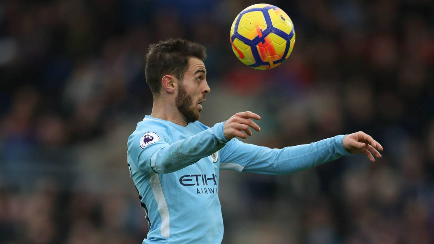 Bernardo Silva Expertly Anticipates To Head The Ball In A Match Background