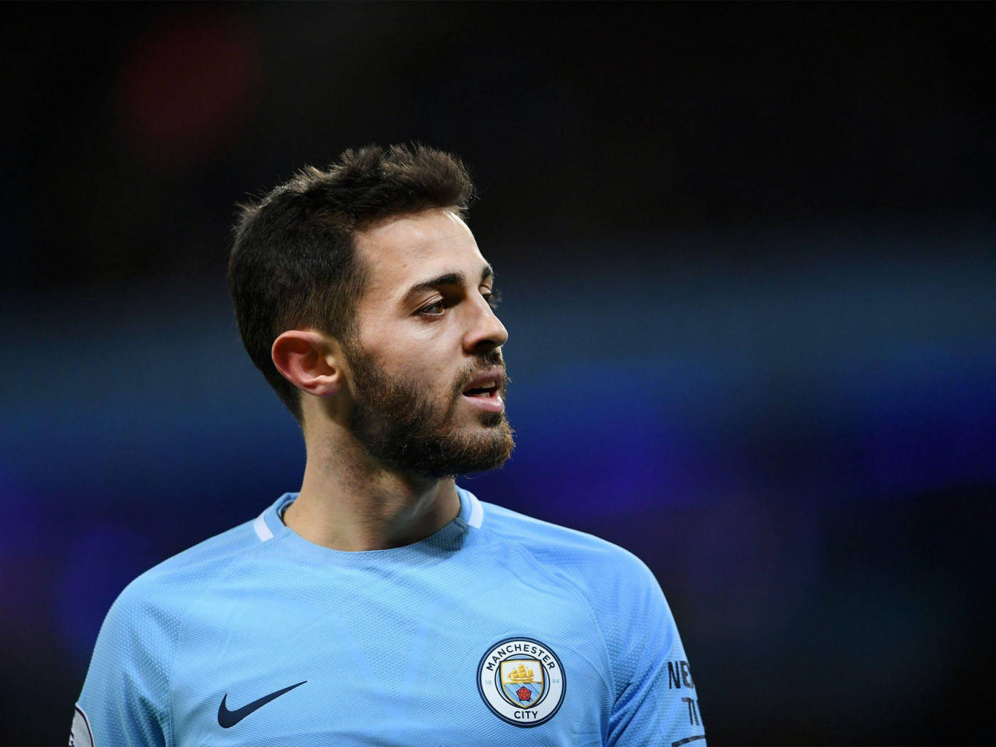 Bernardo Silva Looking Towards His Right In A Game Background