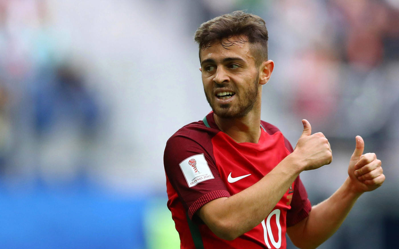 Bernardo Silva Making Two Thumbs Up Gestures Background