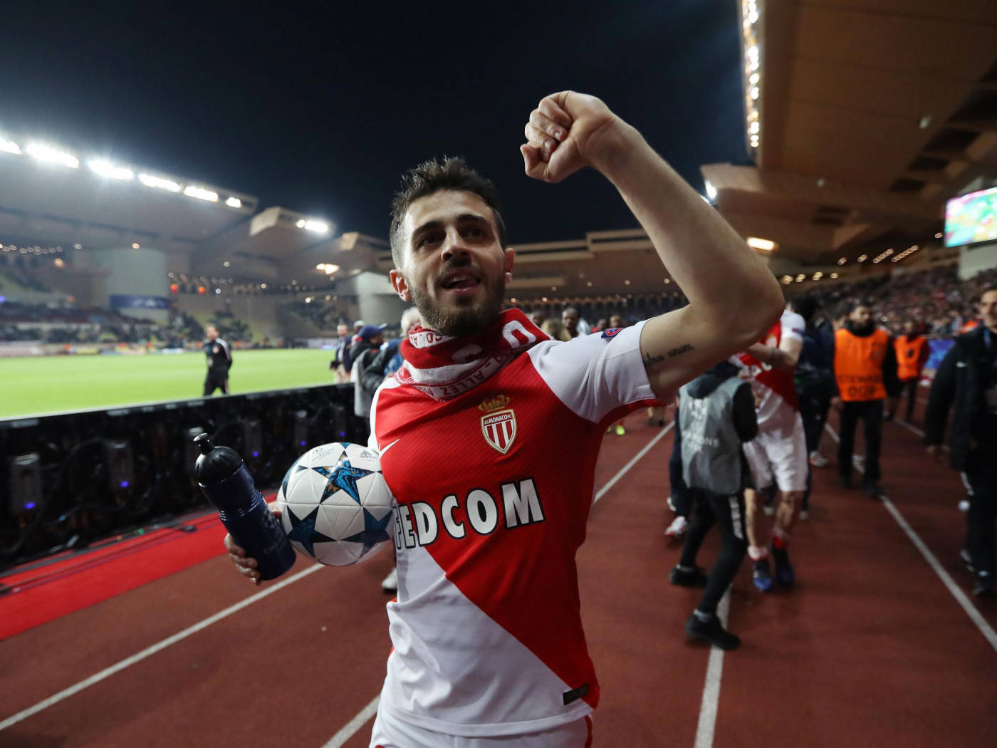 Bernardo Silva Posing With A Football And Cheering Background