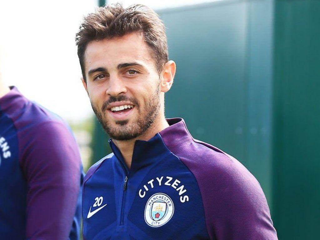 Bernardo Silva Smiling In A Purple Uniform Background