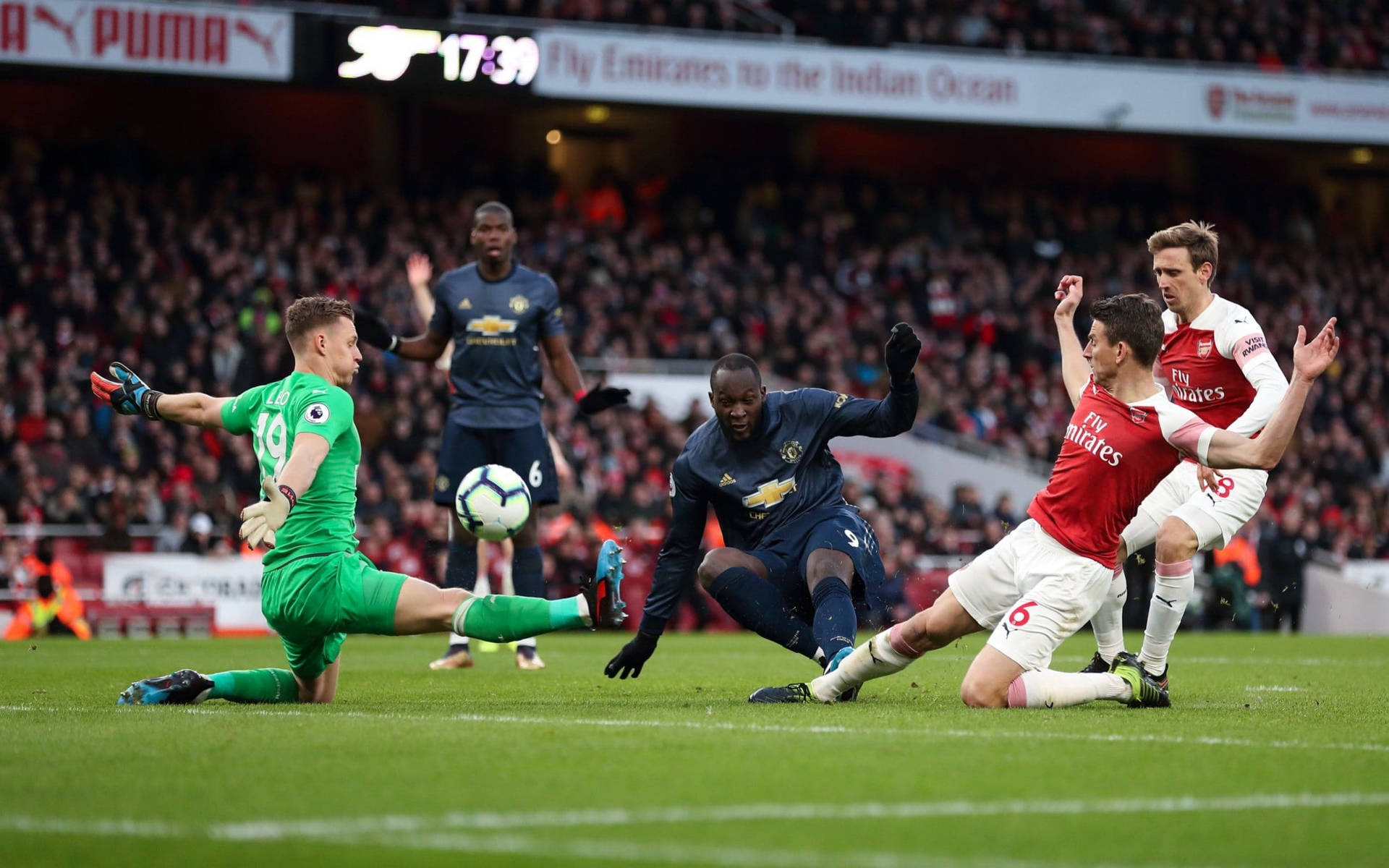 Bernd Leno Blocking The Ball Background