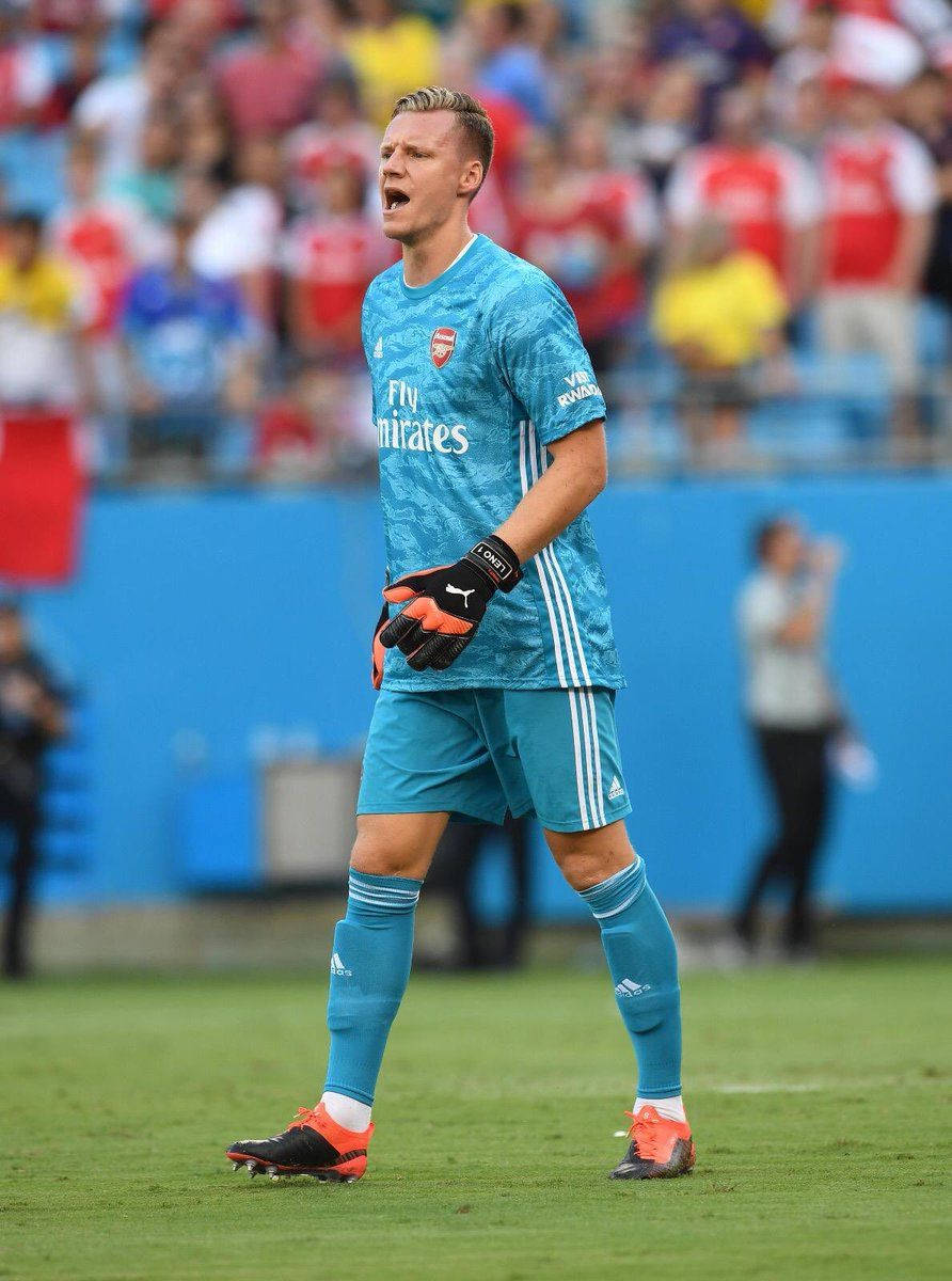 Bernd Leno In Action In Light Blue Jersey Background