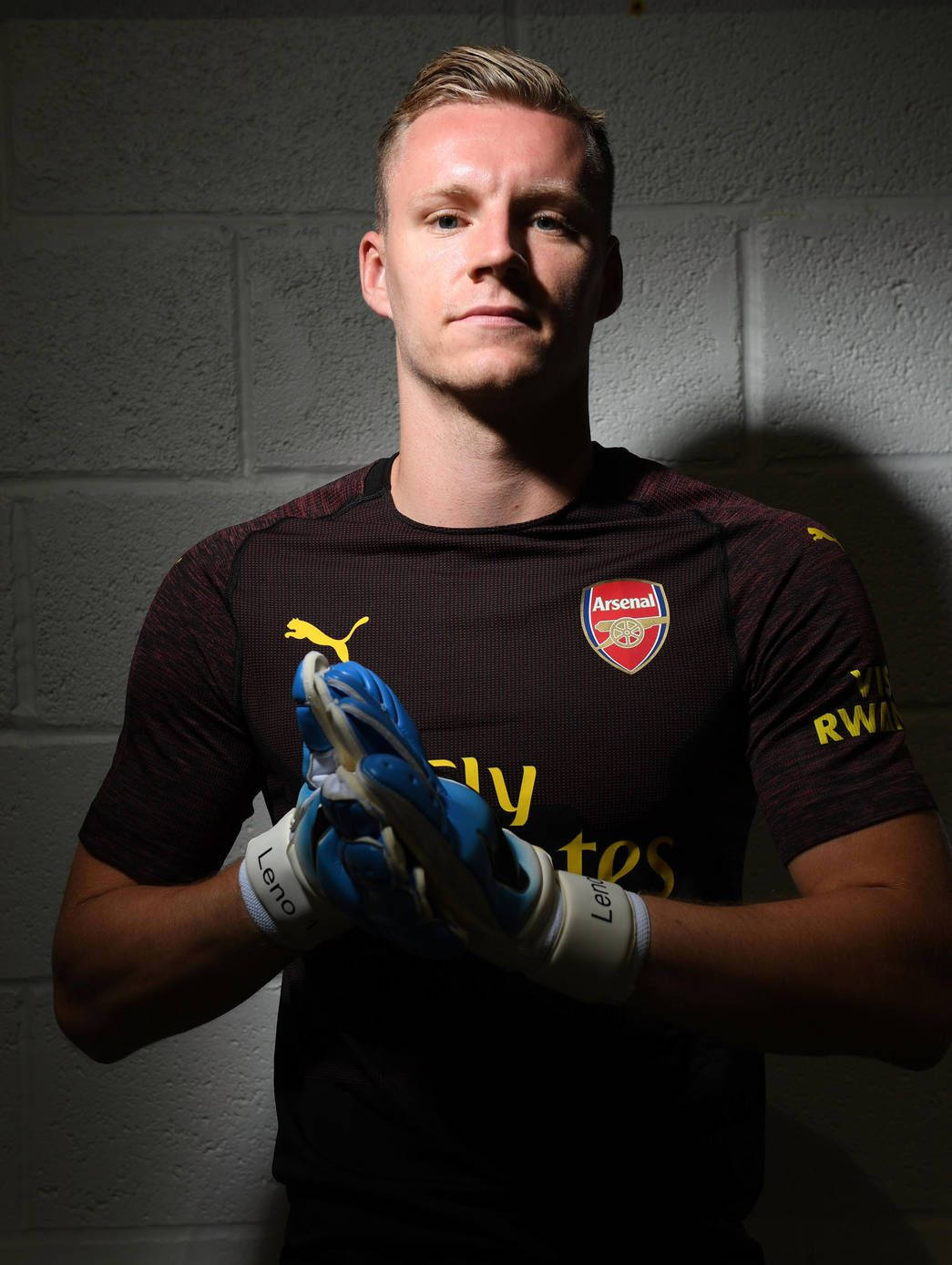 Bernd Leno Posing In Dark Room Background