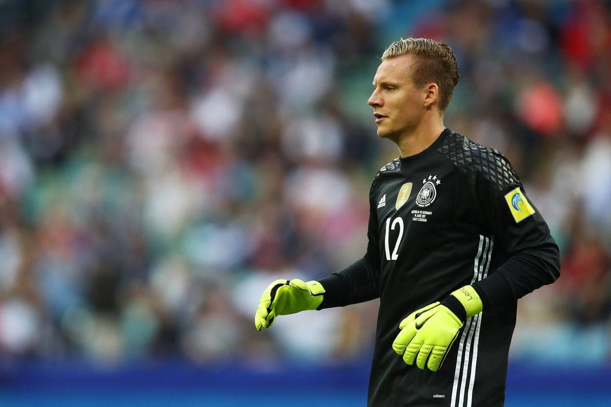 Bernd Leno Wearing Yellow Gloves Background