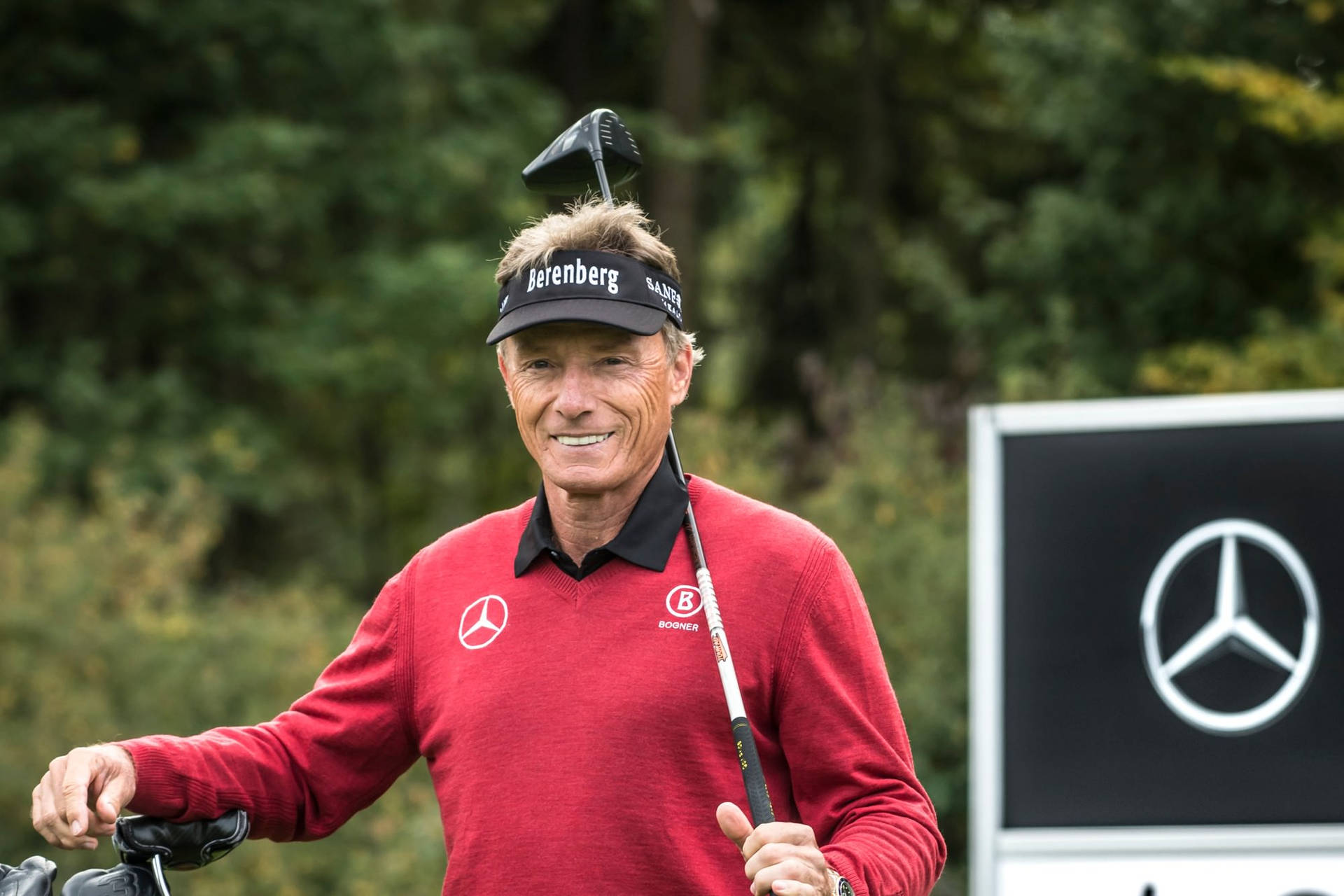 Bernhard Langer Golf Club On His Shoulder Background