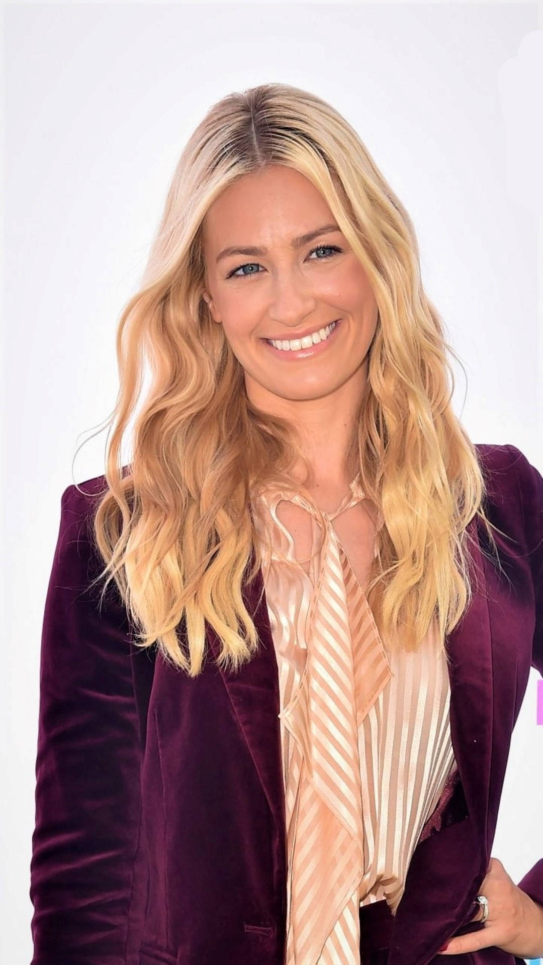 Beth Behrs In Purple Blazer Background