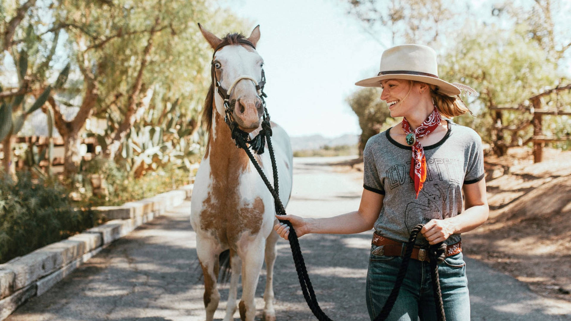 Beth Behrs With A Horse Background