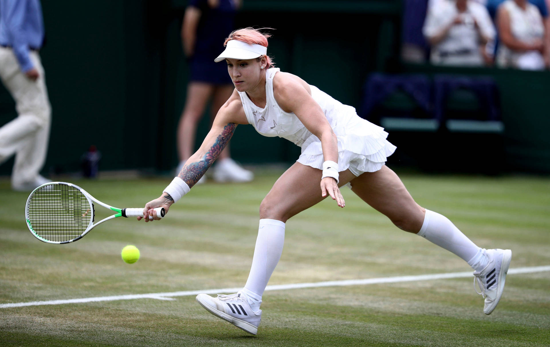 Bethanie Mattek-sands Engrossed In Chasing A Tennis Ball During A Match