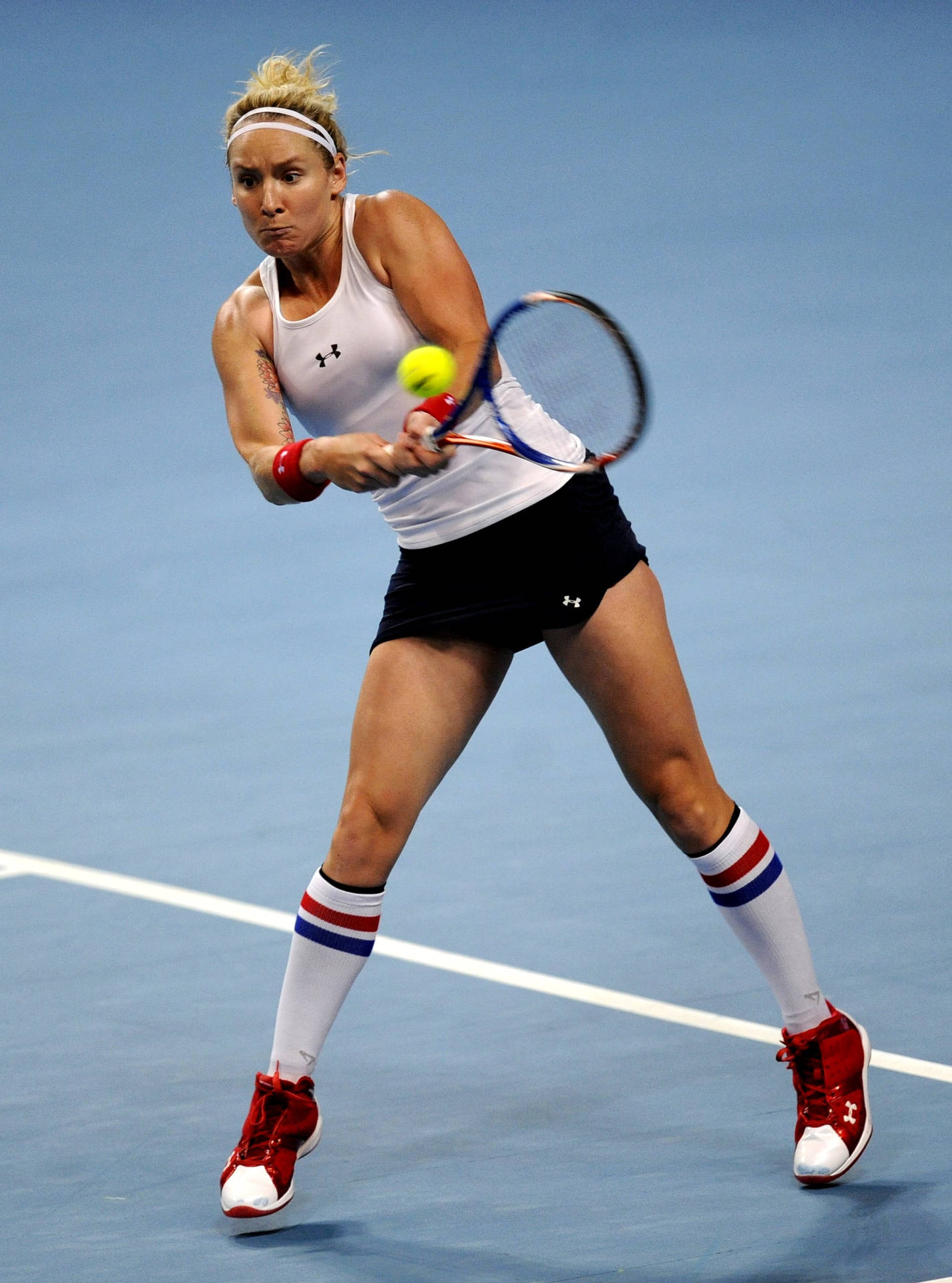 Bethanie Mattek-sands In Action On The Tennis Court Background