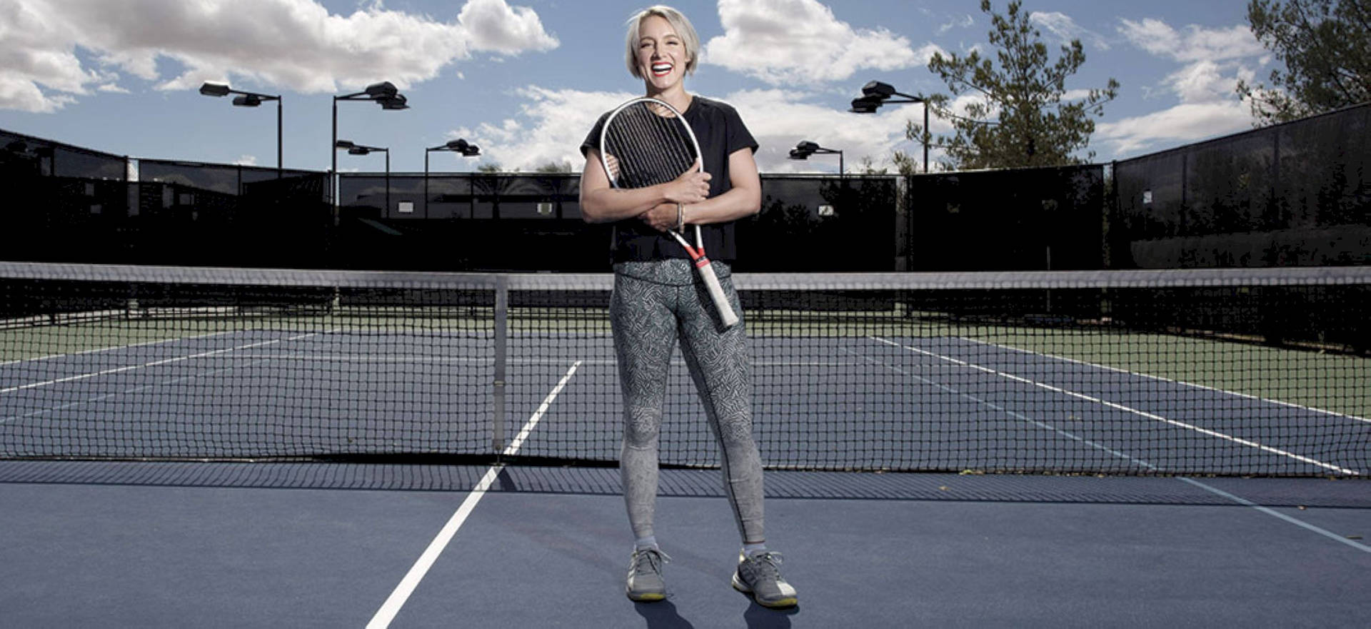 Bethanie Mattek-sands Showing Off Her Skills On Tennis Court Background