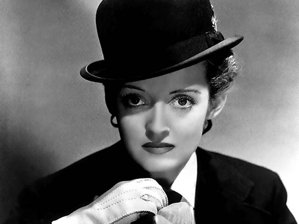 Bette Davis Wearing Bowler Hat Background