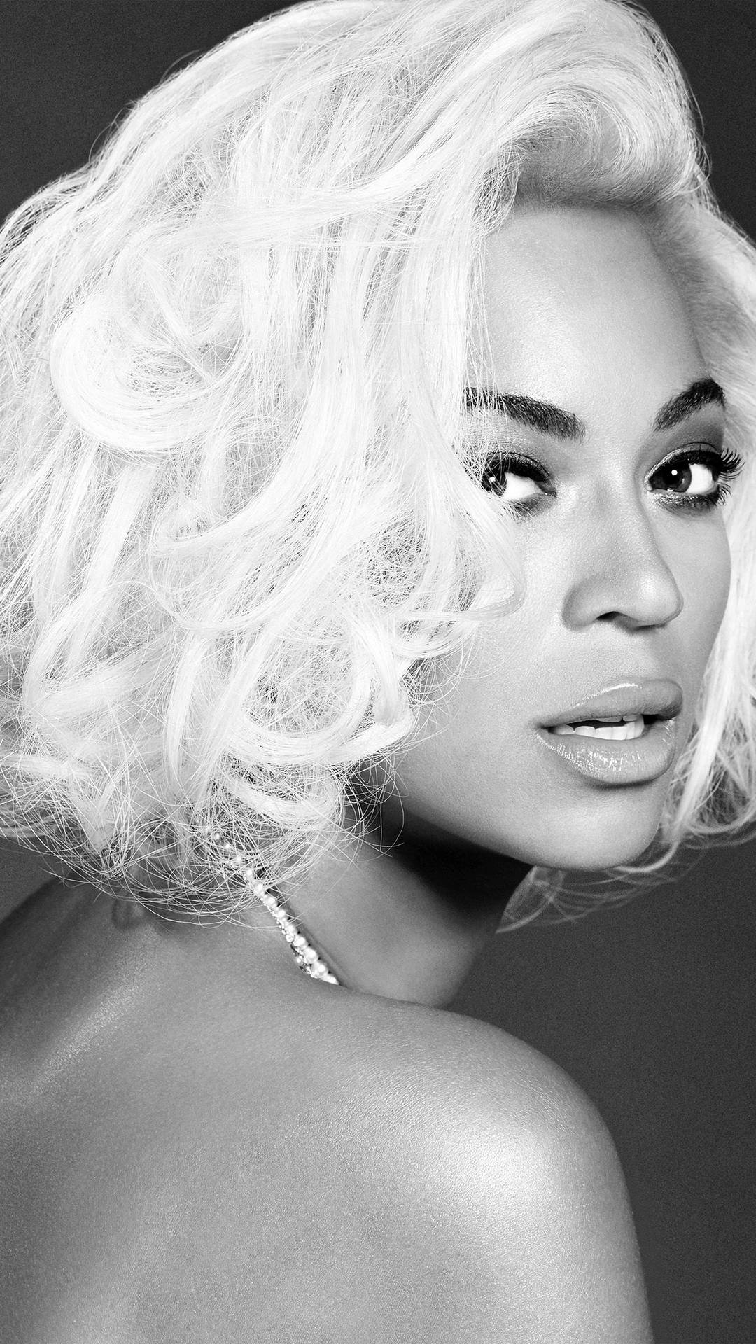 Beyonce Strikes A Pose With Her Iconic Short Bob. Background