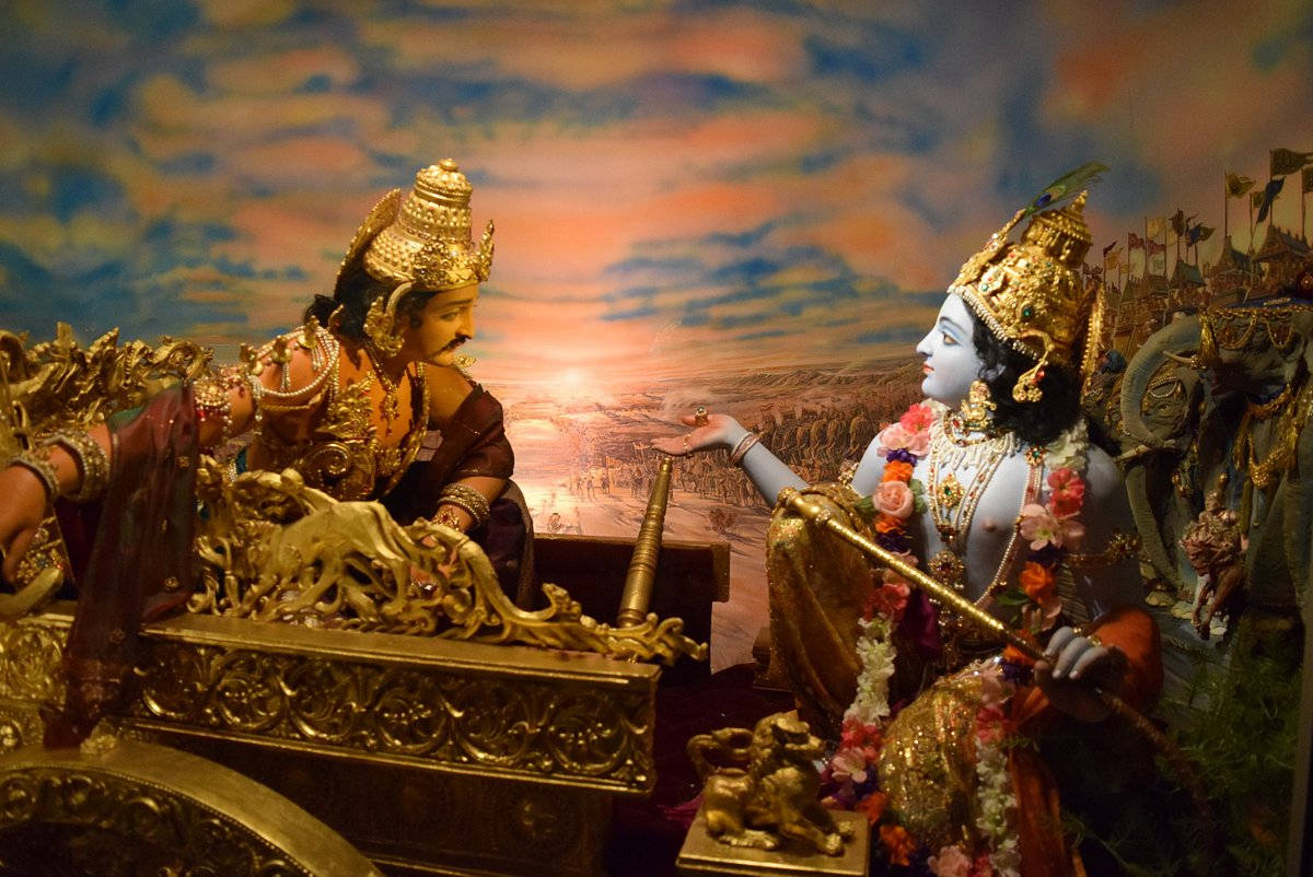 Bhagavad Gita Lord Krishna And Prince Arjuna Statue Background