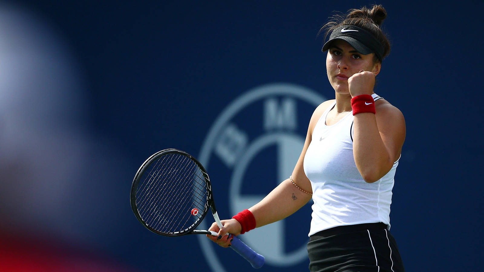 Bianca Andreescu Triumphantly Pumping Her Fist Background