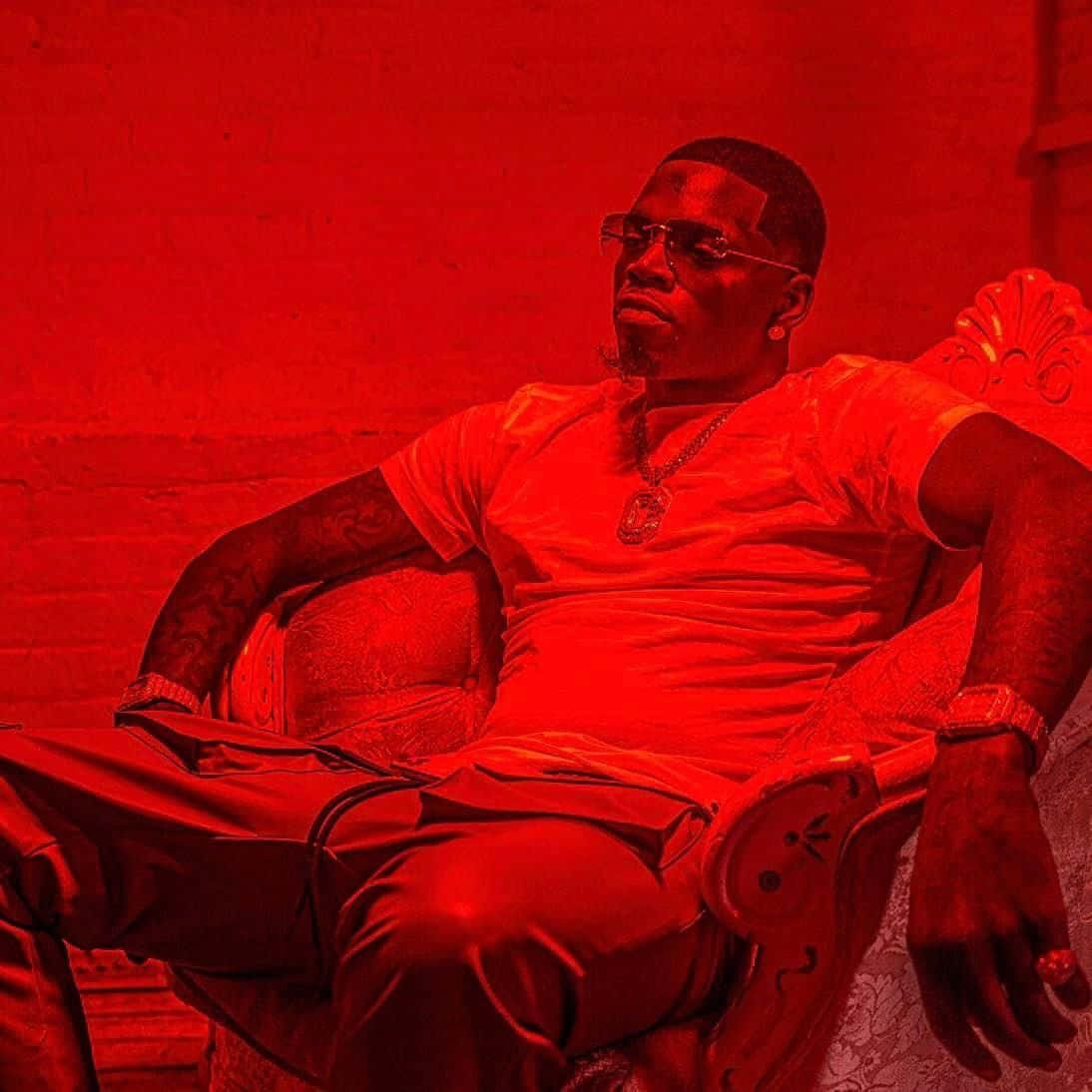 Big Boogie Relaxing In A Red Room Background