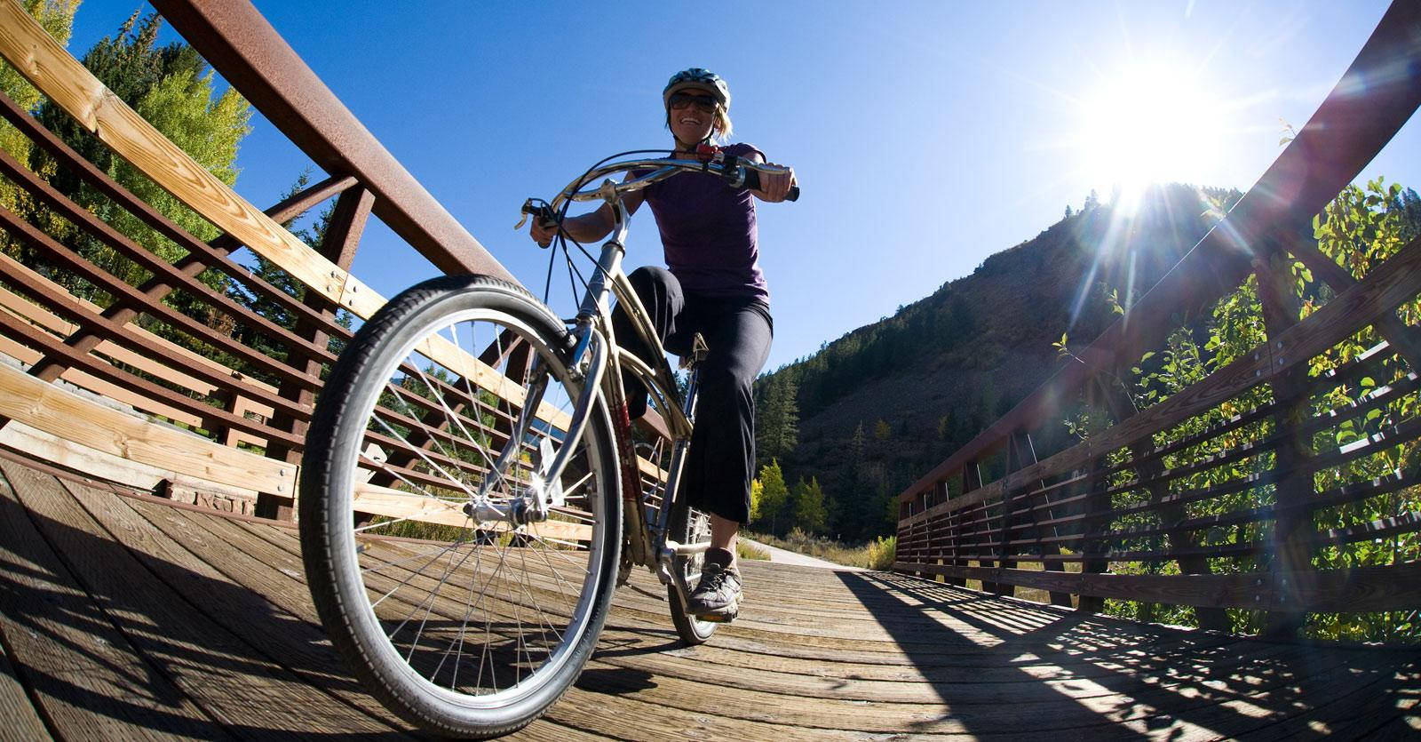 Bike Ride On Bridge Background