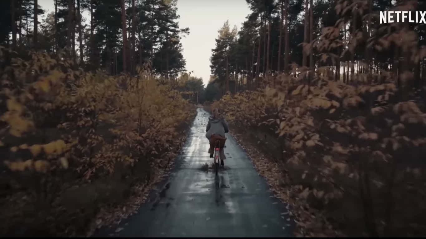 Biking In The Forest Scene In The Dark Netflix Series Background