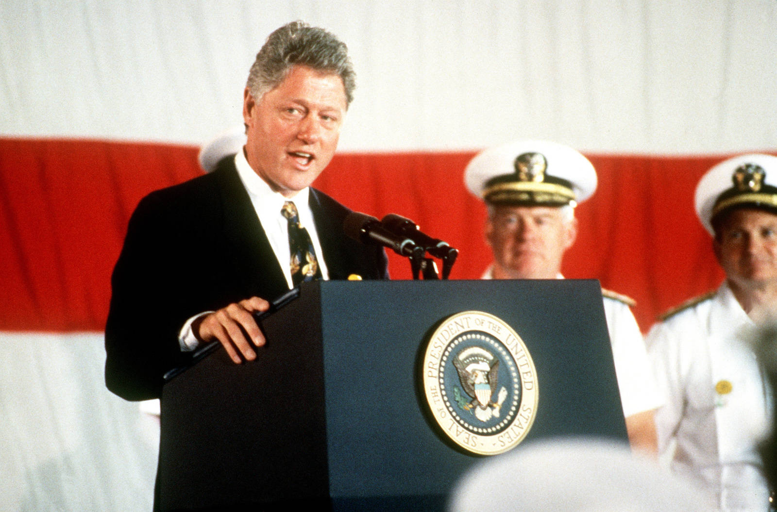 Bill Clinton In A Podium Background