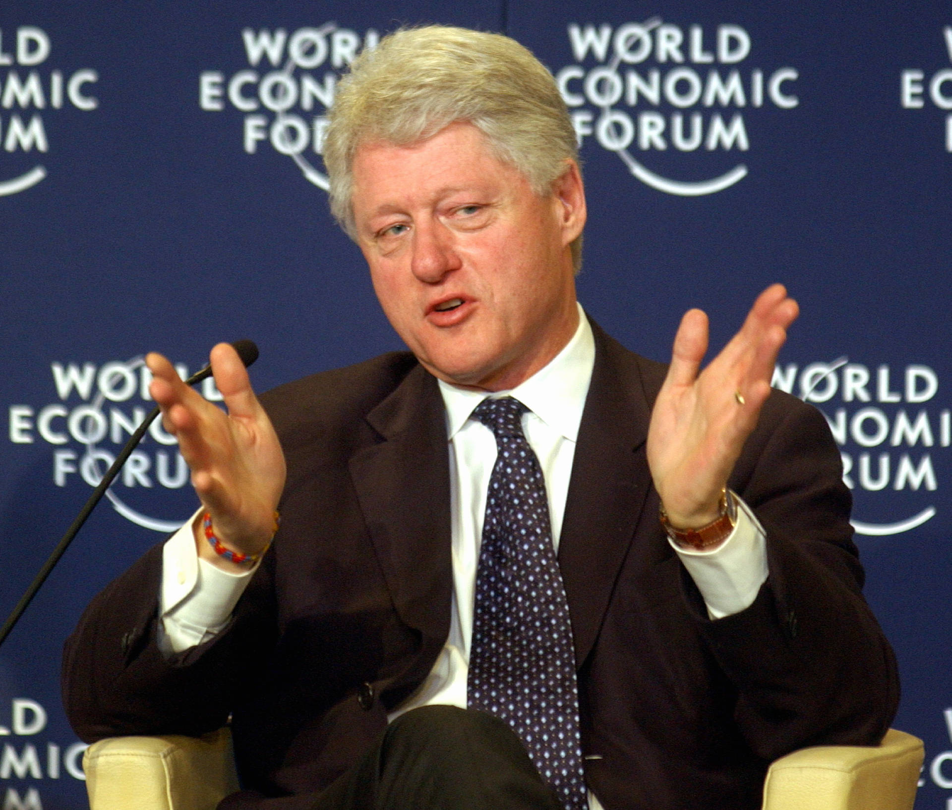 Bill Clinton Speaking At A World Forum Background