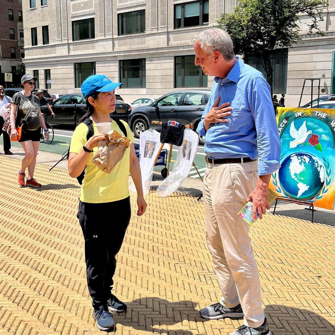 Bill De Blasio Engaging In Conversation With A Woman