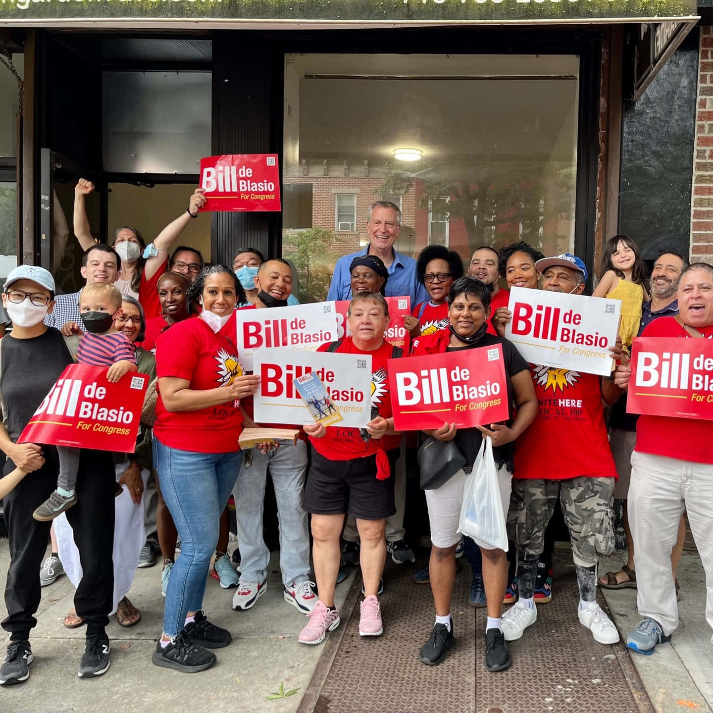 Bill De Blasio Smiling With Supporters Background
