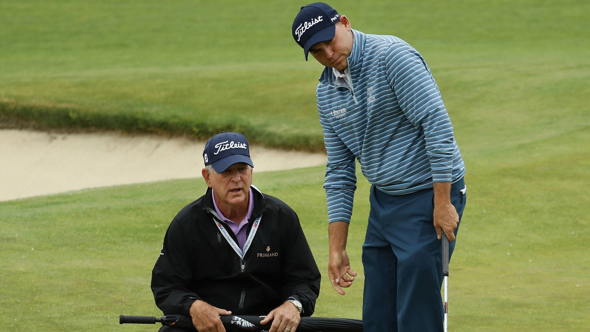 Bill Haas And His Father, Jay Haas, Sharing A Moment On The Golf Course Background