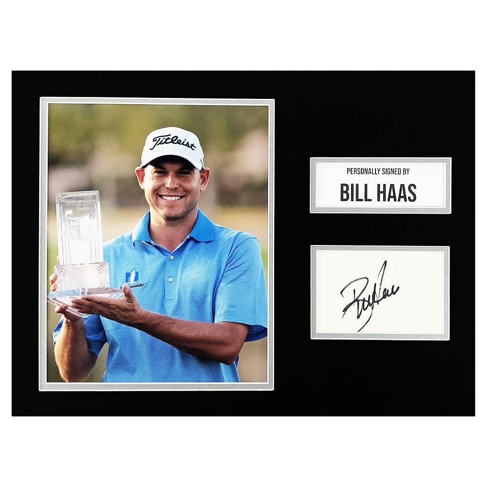 Bill Haas Holding A Trophy Background