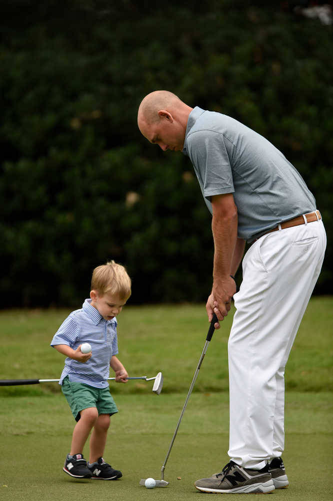 Bill Haas Playing With A Baby Background