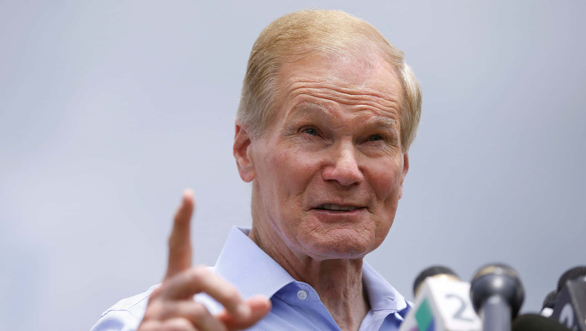 Bill Nelson Pointing Upward Background