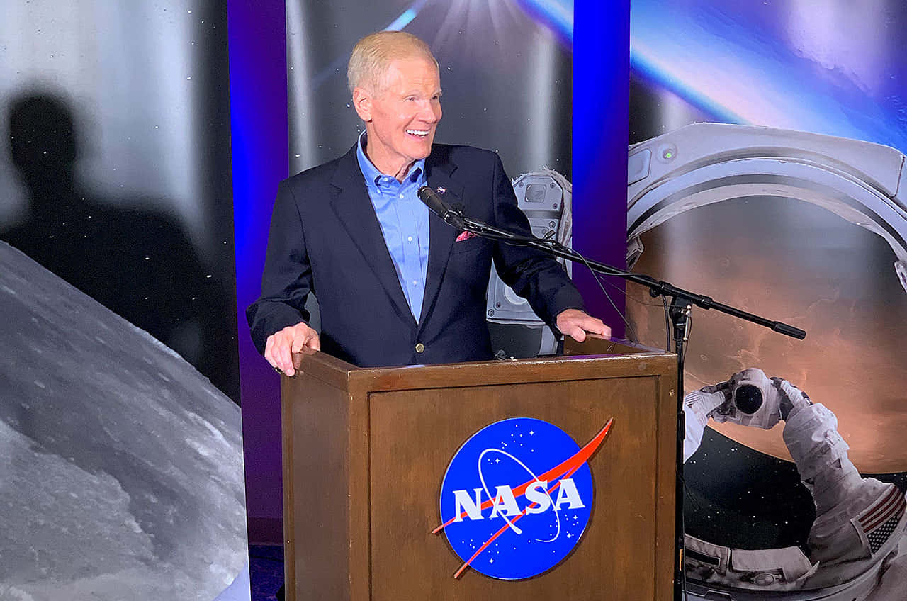 Bill Nelson Speaking On Nasa Podium Background